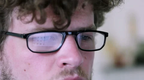 A man with glasses is using a computer Stock Footage 40185428