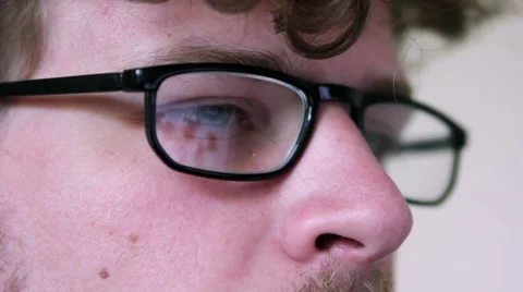 A man with glasses is using a computer Stock Footage 40185566