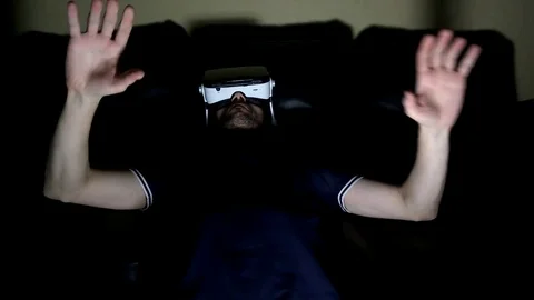 The man in glasses virtual reality plays Stock-Footage 73010765