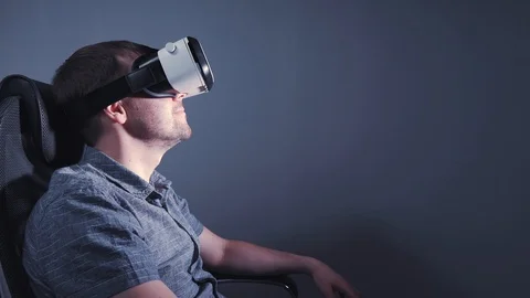 A man with glasses of virtual reality is surprised. 4k video Stock Footage 115089448