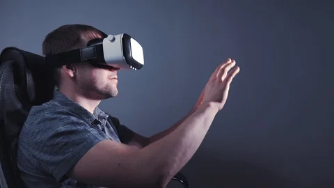 A man with glasses of virtual reality is surprised. 4k video Stock Footage 115089475