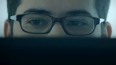 Man with glasses working on computer Video stock 102238952
