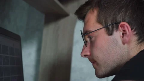 Man with glasses is working at a computer Video stock 140089827
