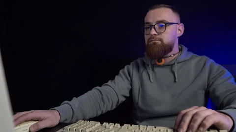 Man With Glasses Working on Desktop Computer From 1990's in Dark Room 스톡 동영상 302459872