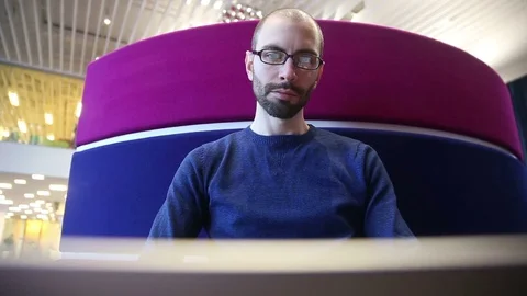 Man with glasses working on laptop Video stock 69976738