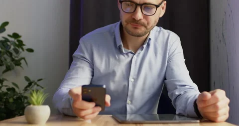 A man with glasses works in a cafe Video stock 219403873