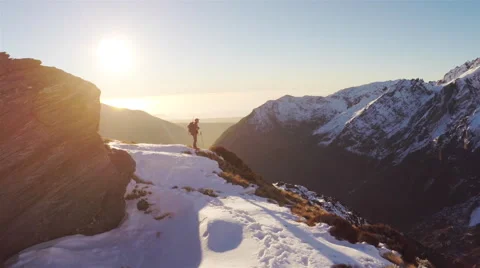 Man glassing on mountain side before sunset. Stock Footage 49832423