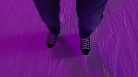 Man Gliding on Ice Under Pink Holiday Lights Stock Footage 292790971