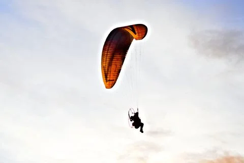 Man gliding over the coastline Foto stock