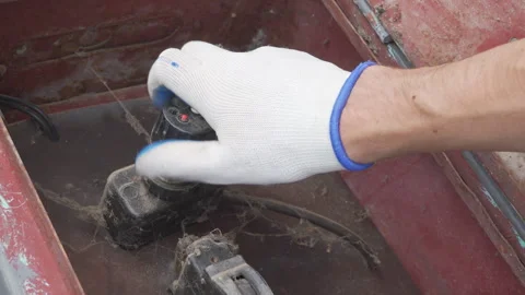 Man in gloves maintains old electrical switchboard Stock Footage 322117283
