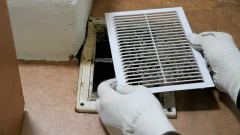 Man in gloves opens dusty ventilation grille. Stock Footage 112277559