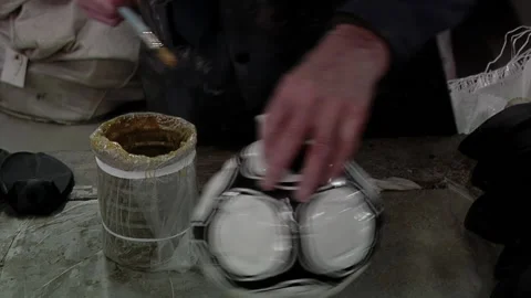 Man Glueing the Bladders and Covers of Soccer Balls While Putting the Bladder. Stock Footage 152015585