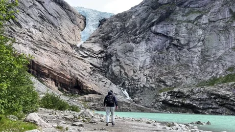 A man go Briksdalsbreen Stock Footage 308088051