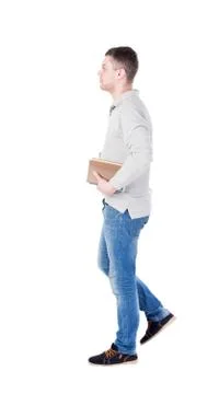 Man goes and has a stack of books Stock Photos