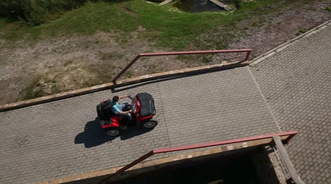 Man goes on ATV Vídeos de archivo 57950575