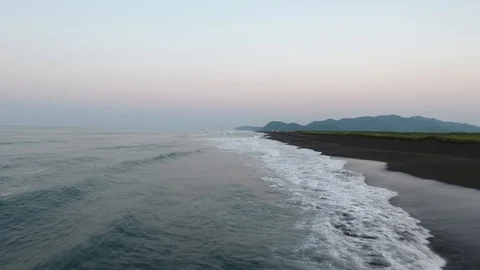 Man goes to the beach of the ocean. Stock Footage 104197172