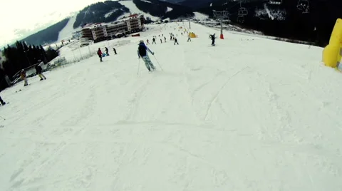A man goes down on skis in the mountains and falls Stock Footage 61793253