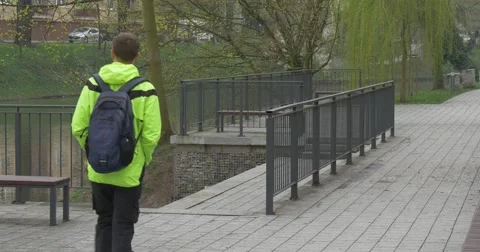 Man Goes Down by Stairs and Approaches to Tree Stock Footage 62186855