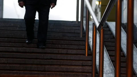 A man goes down the stairs to the underpass. View from the bottom and front Stock Footage 119218818