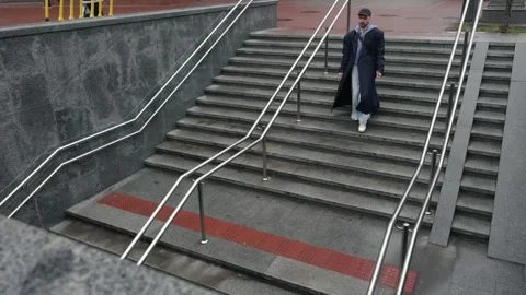 A man goes down the steps in the subway Stock Footage 270085053