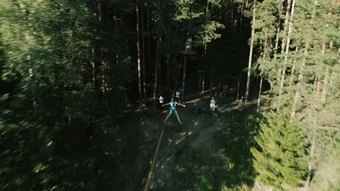 Man goes down the troll in the forest in a camp in nature5 Video stock 134489323