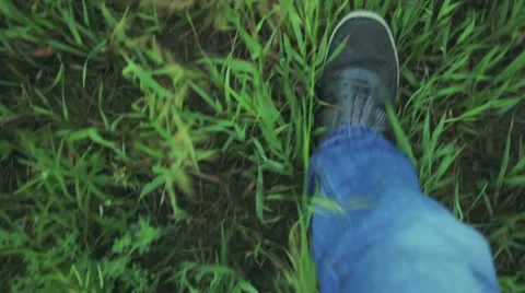 Man goes on the grass Stock Footage