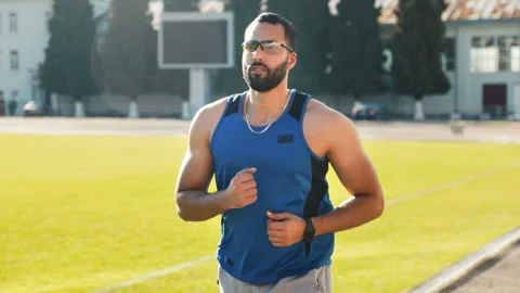 Man Goes Jogging in Stadium 動画素材 101540425