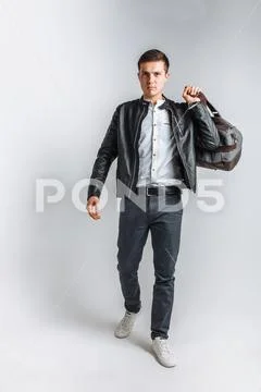 Man goes on a journey. The guy in the Studio. The guy in the black jacket. Ha Stock Photos
