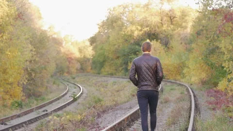 A man goes on rails in the forest Video stock 97043291