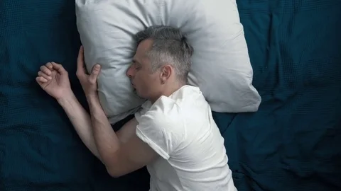 A man goes to sleep after a hard day. Stock Footage 83107785