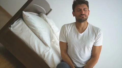 The man goes to sleep on the bed Stock Footage 90101600