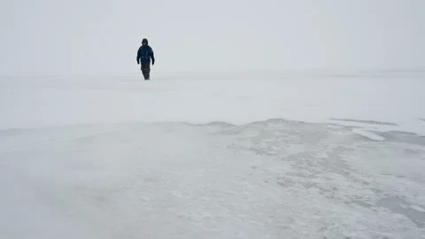 A man goes in a snowstorm. Stock Footage 121053092