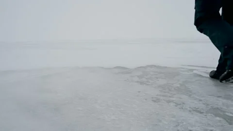 A man goes in a snowstorm. Stock Footage 121053417