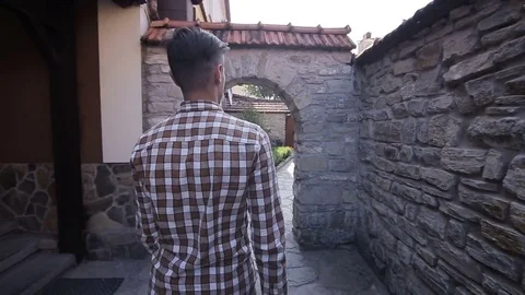 Man goes through the ancient streets Stock Footage 71015005