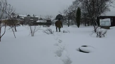 A man goes through the deep snow Video stock 21296388