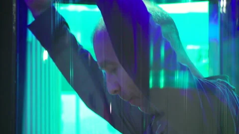 The man goes through the security framework Stock Footage 88494537