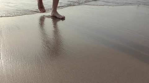 A man going to the beach from the sea Stock Footage 64210206