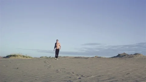 Man going in desert Stock Footage 77454152