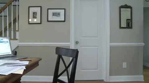A man  going to dining room table to work on his finances (3 of 4) Stock Footage 10564946