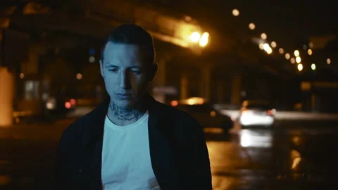 Man Going Down The Empty Street. Sad Young Man at The Rain Stock Footage 141882727