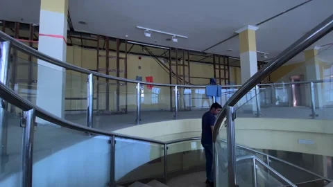 A man going down the stairs after abundant Building Investigation Vídeo Stock 277252909