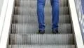 A man going up on escalator stairway HD Footage