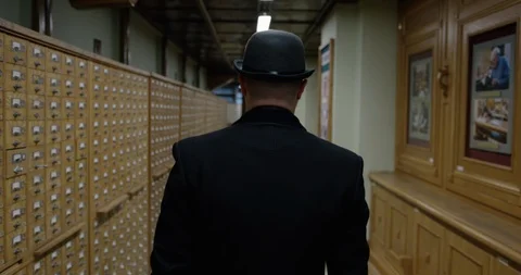 Man going into file cabinet Stock Footage 86512553