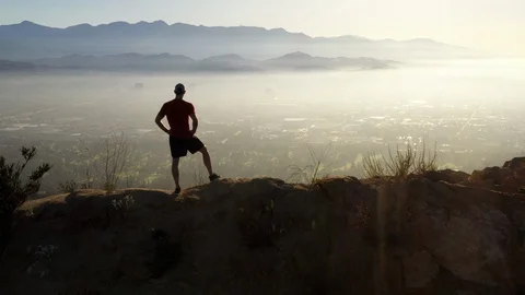A man going for his moring workout in the hills above Hallywood Video stock 114589102