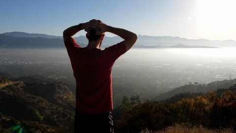 A man going for his moring workout in the hills above Hallywood Video stock 114589912