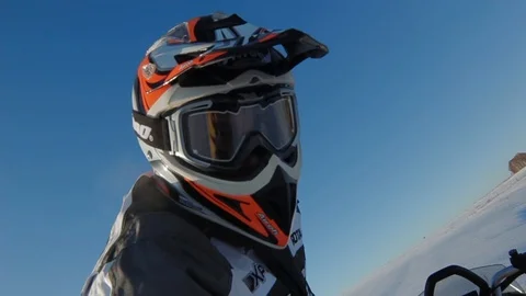 Man is going to ride a snowmobile Stock Footage 99925452