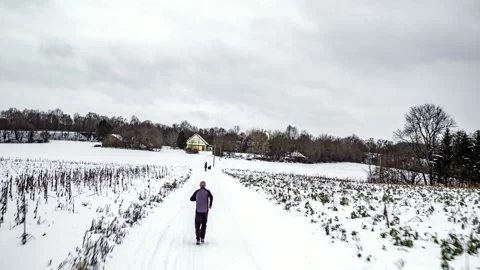 Man going for a run in winter Video stock 147325848