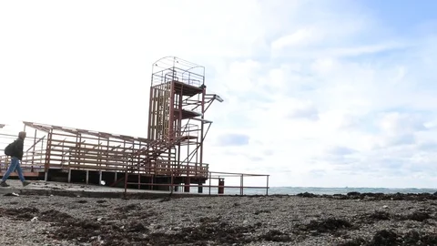 Man going to the sea in Old station. Stock Footage 99698399