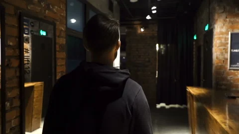 Man is going through the corridor Video stock 86256663