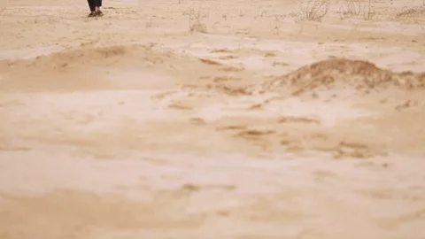 Man is going through desert. Feet closeup Stock Footage 107854282